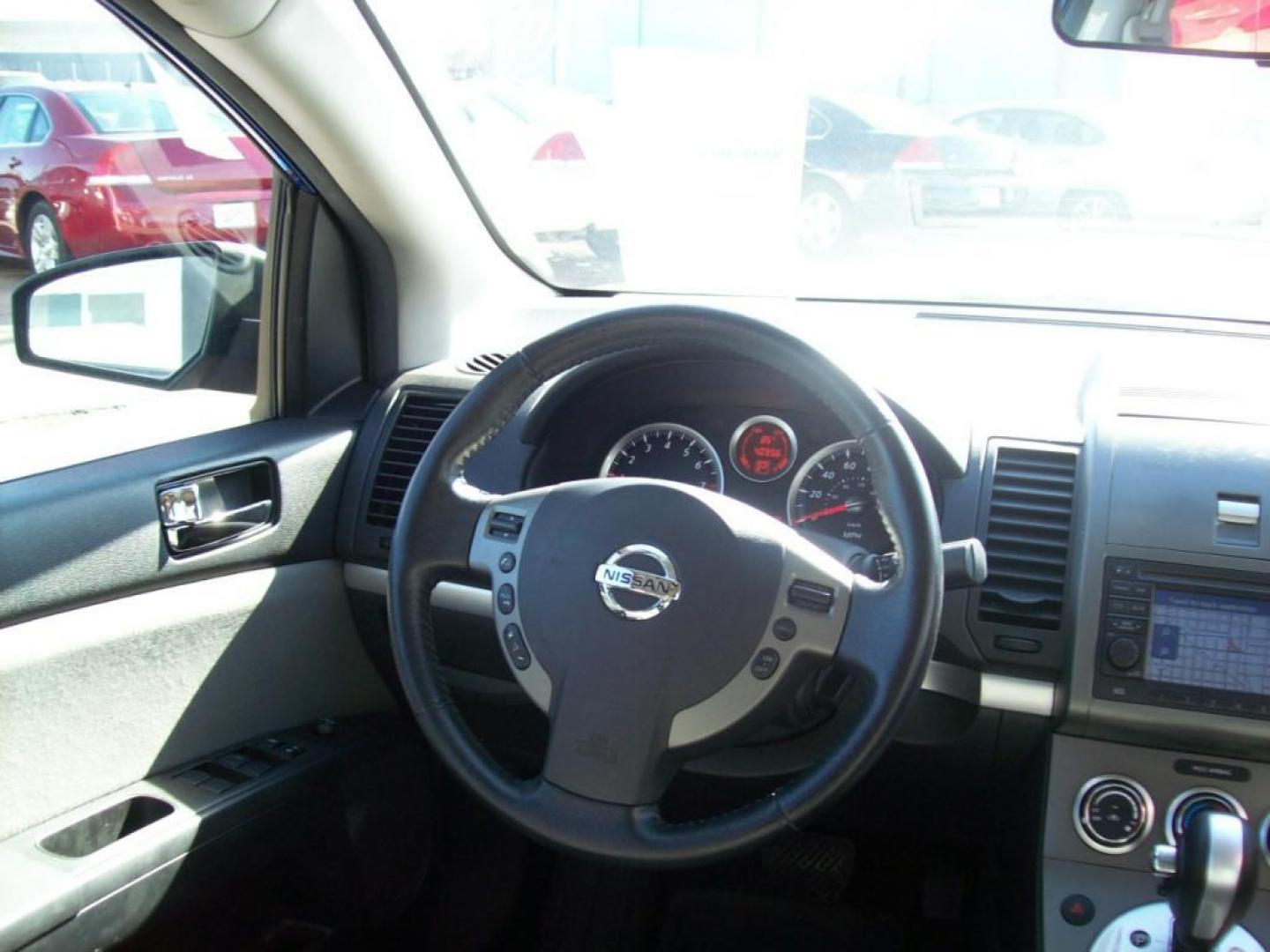 2011 Blue /Gray Nissan Sentra 2.0; 2.0 S; 2.0 SL; 2.0 SR (3N1AB6AP0BL) with an L4, 2.0L engine, Automatic transmission, located at 220 West South St., Hastings, NE, 68901, (402) 461-3161, 0.000000, 0.000000 - This is a Special Edition! Leather, AM-FM-CD, Navigation System, Satellite Radio - XM, Front Wheel Drive, Cruise Control, Power Windows and Locks, Rear Defrost, Power Driver's Seat, Split Back Seat, Alloy Wheels. - Photo#5