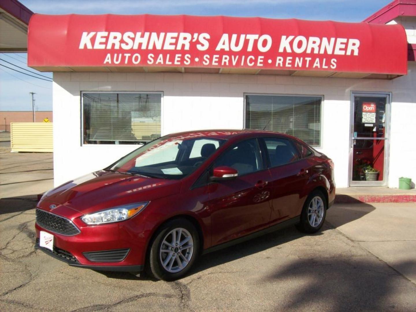 2015 Red /Graphite Grey Ford Focus SE (1FADP3F29FL) with an L4, 2.0L; FFV engine, Automatic transmission, located at 220 West South St., Hastings, NE, 68901, (402) 461-3161, 0.000000, 0.000000 - Photo#0