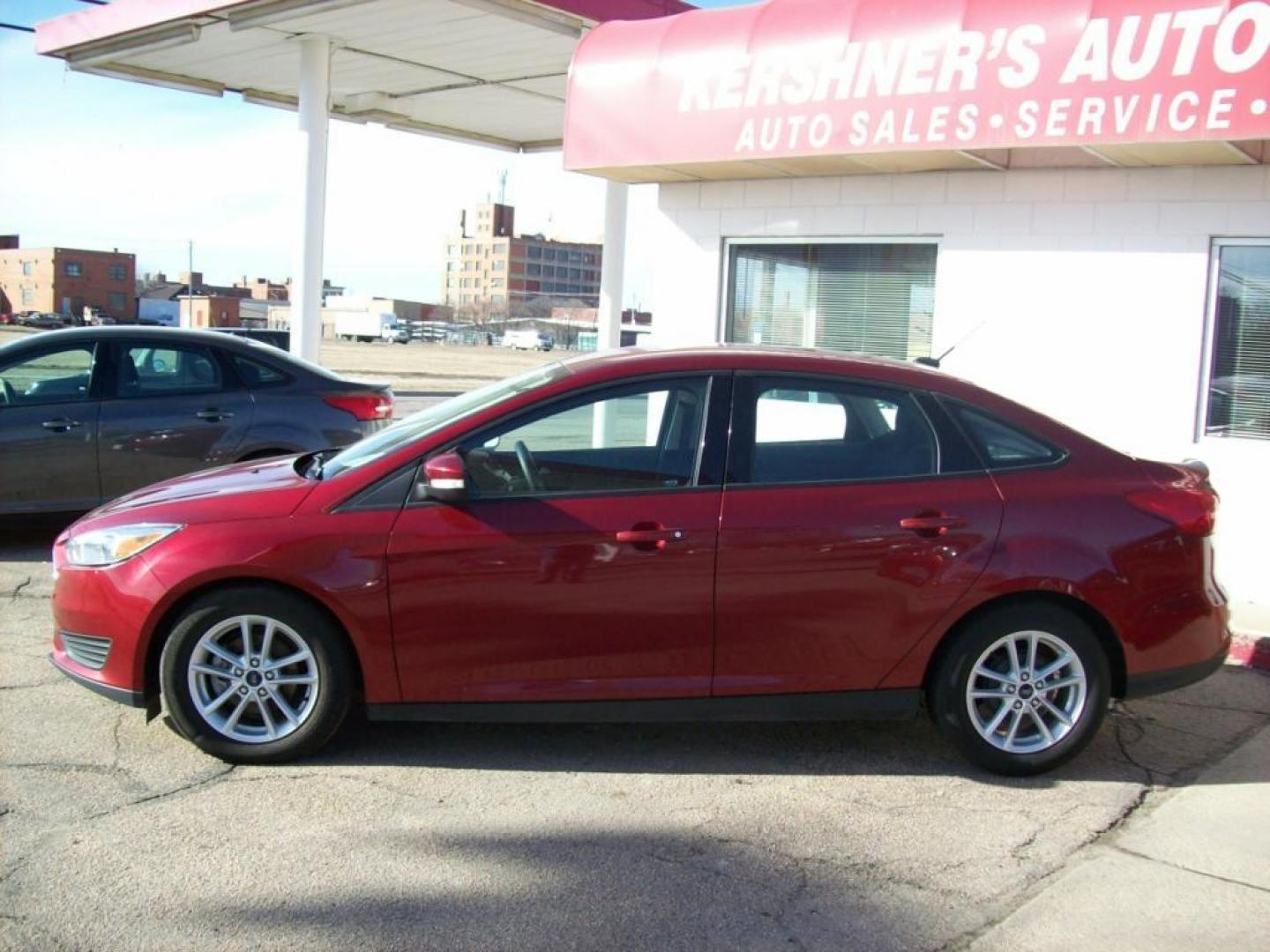 2015 Red /Graphite Grey Ford Focus SE (1FADP3F29FL) with an L4, 2.0L; FFV engine, Automatic transmission, located at 220 West South St., Hastings, NE, 68901, (402) 461-3161, 0.000000, 0.000000 - Great Gas Mileage, Back-up Camera, 25,xxx Miles - Photo#1