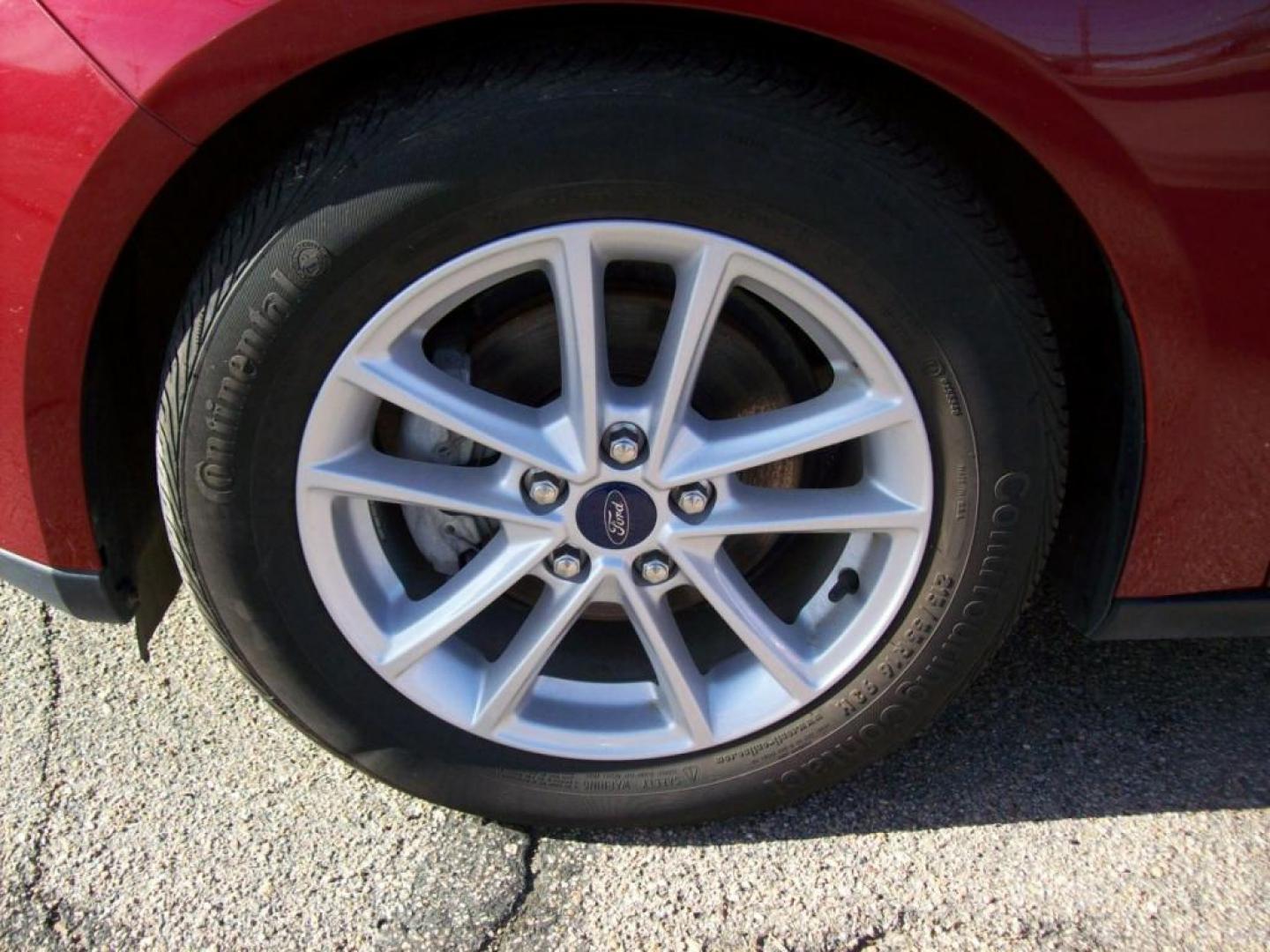 2015 Red /Graphite Grey Ford Focus SE (1FADP3F29FL) with an L4, 2.0L; FFV engine, Automatic transmission, located at 220 West South St., Hastings, NE, 68901, (402) 461-3161, 0.000000, 0.000000 - Great Gas Mileage, Back-up Camera, 25,xxx Miles - Photo#2